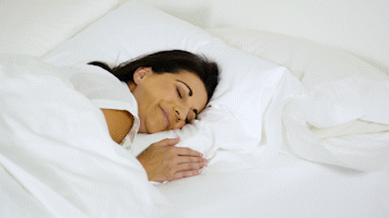 Woman sleeping comfortably in bed